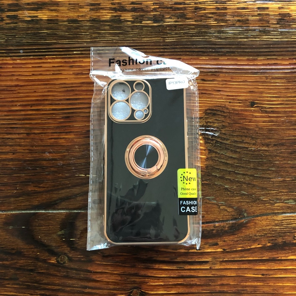 Black silicone iPhone 13 Pro case with ring holder.